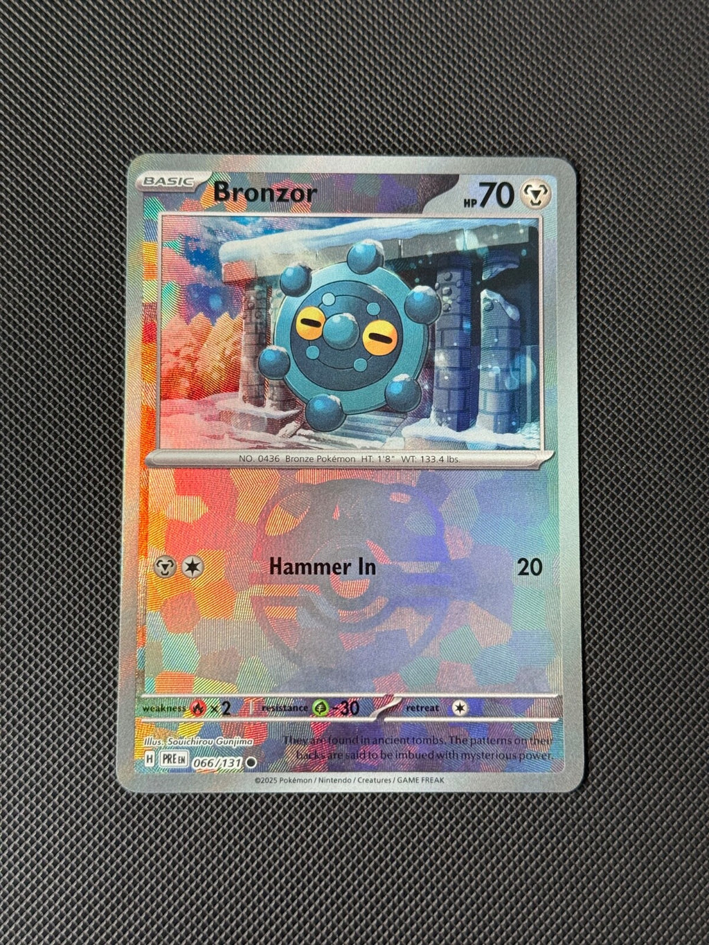 Bronzor 066/131 Master Ball Holo Pokemon Card Prismatic Evolutions NM0