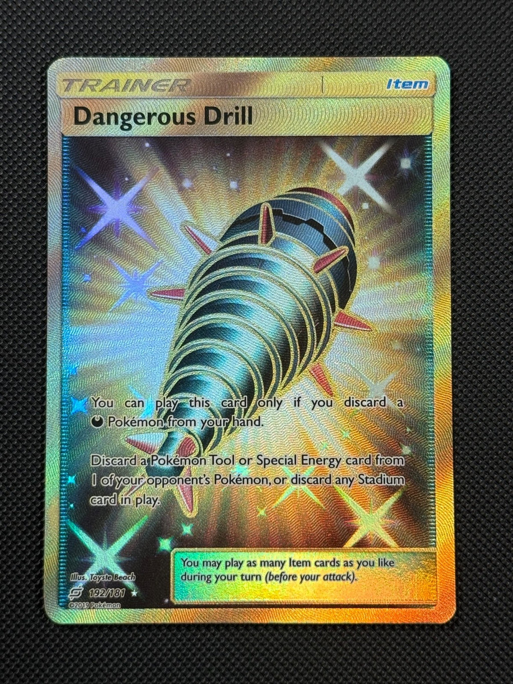 Dangerous Drill 192/181 SECRET Pokémon Card Sun & Moon Team Up Gold Rare0