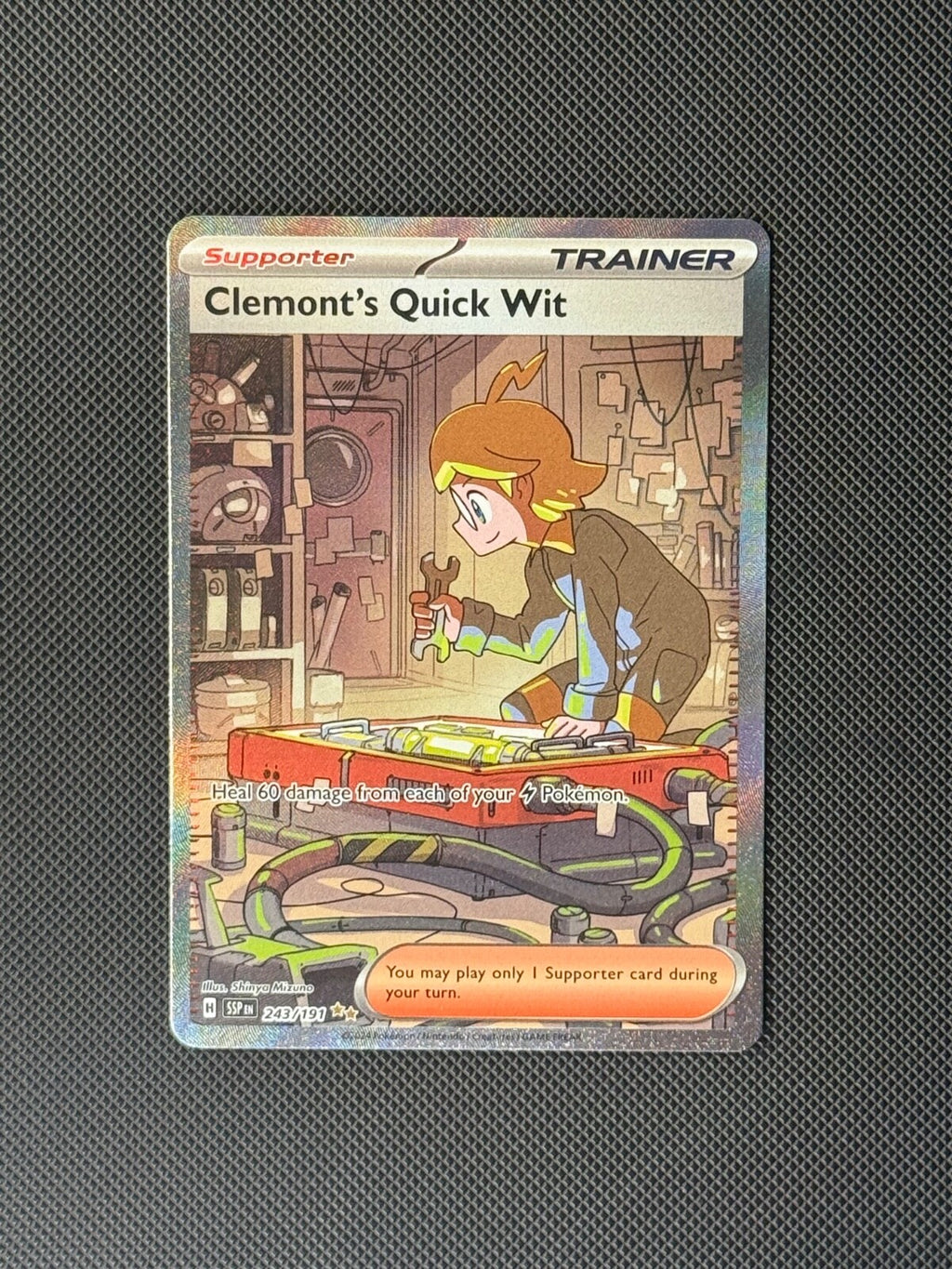 Clemont's Quick Wit 243/191 SIR Pokémon Card Surging Sparks Holo NM0