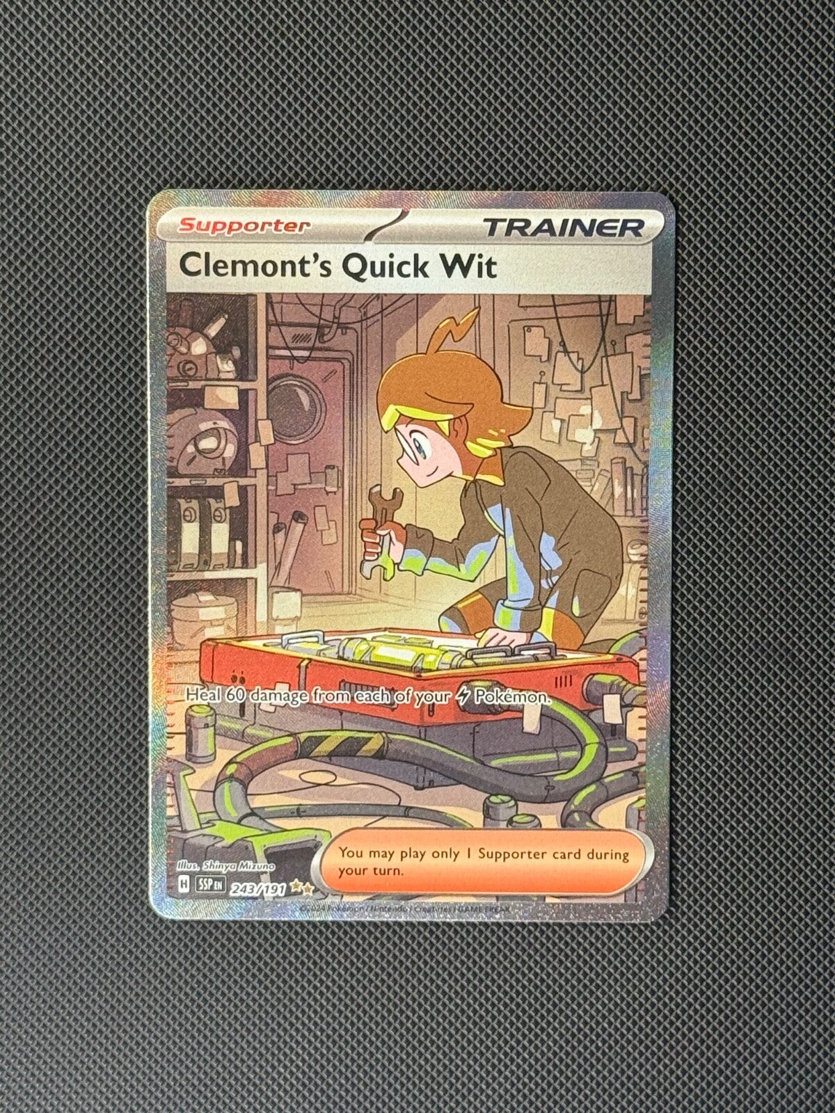 Clemont's Quick Wit 243/191 SIR Pokémon Card Surging Sparks Holo NM0