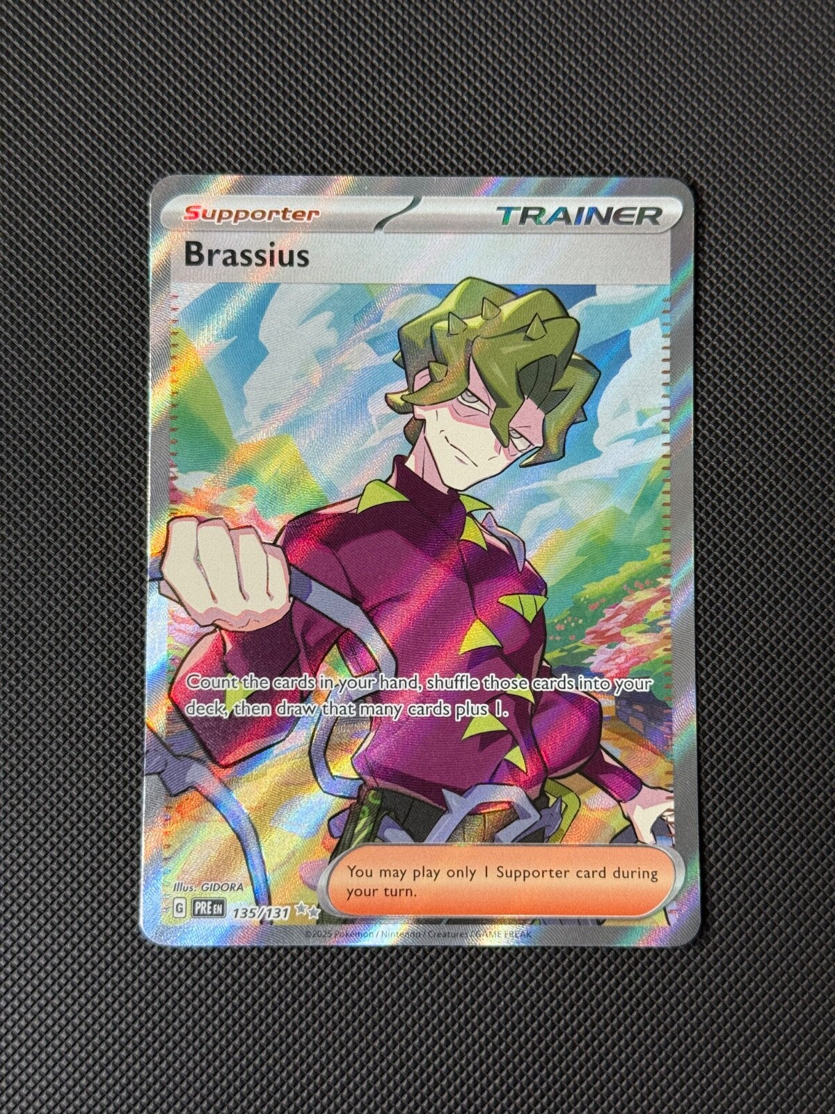 Brassius 135/131 Full Art Trainer Pokémon Card Prismatic Evolutions Holo NM0
